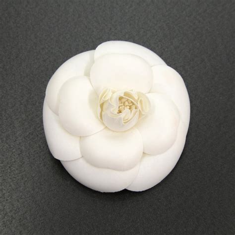 chanel flower vase - Chanel camellia brooch.